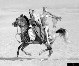 Fashion model Connie Barr photographed on the back of a horse in Egypt for Queen magazine, February 1963.