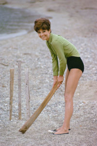 Audrey Hepburn plays cricket on the beach